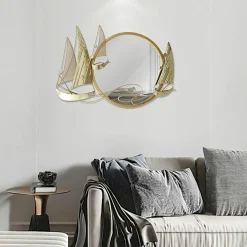 Décoration murale en métal avec miroir rond et bateaux dorés