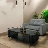Table basse noire pieds dorés double plateau